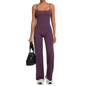 Women's deep purple yoga set with high-waist flared pants and slim sports tank top