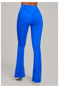 Detail view of high waist royal blue yoga flare pants showing V-shaped back seam and lift