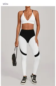 Detail of high waist yoga set featuring white V-neck top and black patchwork leggings
