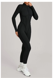 Combinaison de yoga noire à manches longues avec demi-zip et coutures style corset