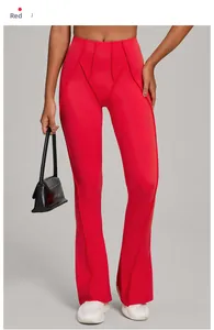 Detail of red high-waisted flared yoga pants with vertical stitching and slimming seams