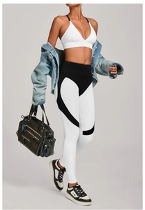 Detail of high waist yoga leggings with heart-shaped color block stitching for fitness