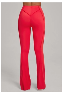 Detail of high waist yoga flare pants in red featuring V-shaped seams and lifting effect