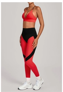 Detail of red and black color-block high waist yoga leggings and sports bra set