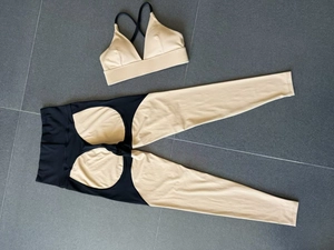 Detailed flat lay of beige and black color-block high-waisted yoga set for fitness