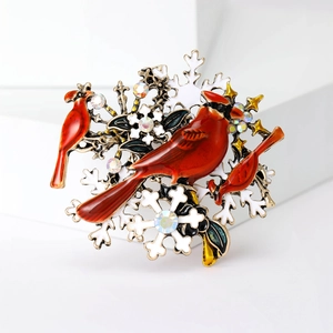 Broche oiseau cardinal rouge avec flocons de neige et strass colorés dorés