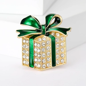 Christmas gift box brooch with green enamel bow and white rhinestones on gold alloy
