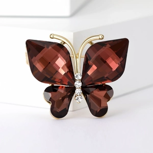 Elegant butterfly brooch with brown crystal wings and sparkling gold-plated metal base