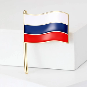 Creative Russian flag brooch with wavy golden edges and vibrant enamel colors on white