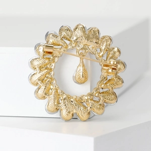 Vintage style gold alloy wreath brooch with teardrop pendant and secure back pin closure
