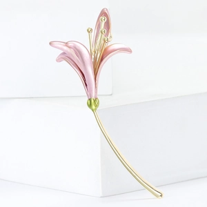 Exquisite pink lily flower brooch with golden stem on minimalist white background