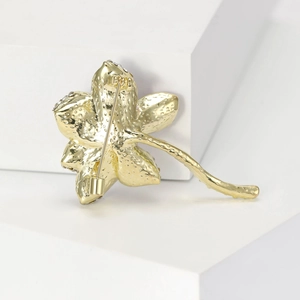 Elegant gold lotus flower brooch with rhinestone accents and textured petals for women