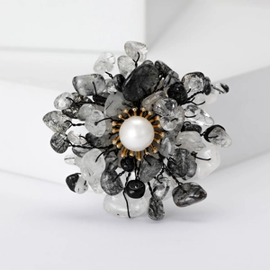 Floral brooch with natural stone rutilated quartz and pearl on golden metal base