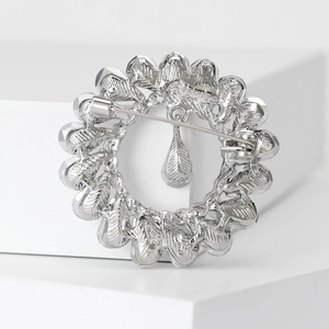 Vintage silver alloy wreath brooch with teardrop pendant and secure pin clasp for women