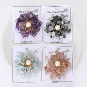 Detailed cluster of handmade stone flower brooches with copper wire and faux pearls