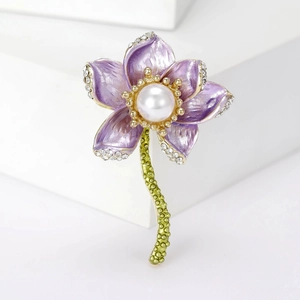Detail of purple lotus brooch with sparkling rhinestones, pearl center and green stem
