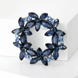 Elegant silver wreath brooch with deep blue marquise crystals and light blue rhinestones
