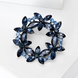 Elegant crystal wreath brooch with deep blue faceted flowers and silver alloy base