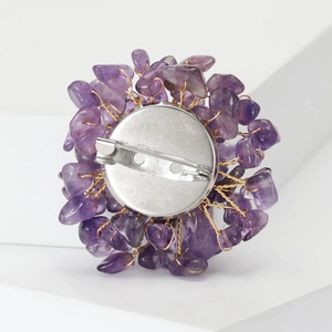 Detailed back view of purple crystal stone brooch with secure metal pin clasp