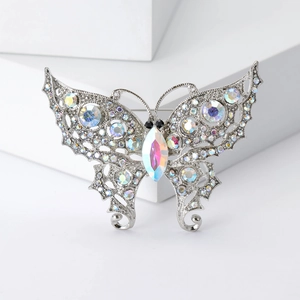 Detail of vintage butterfly brooch with silver plating and colorful AB rhinestones