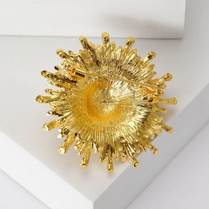 Elegant gold vintage sapphire sunflower brooch with irregular lines on white stone
