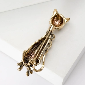 Vintage gold cat brooch showing the detailed back structure and horizontal pin clasp
