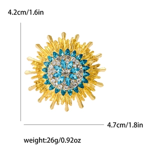 Gold sunflower brooch with blue gems and diamonds, size 4.7cm x 4.2cm, 26g weight