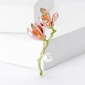 Elegant magnolia flower brooch with pink petals, green stem and large round pearl accent