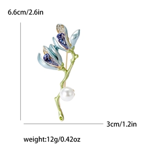 Elegant magnolia flower brooch with blue enamel petals and pearls for suit decoration