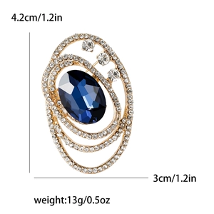 Elegant vintage oval blue crystal brooch with white rhinestones in gold setting