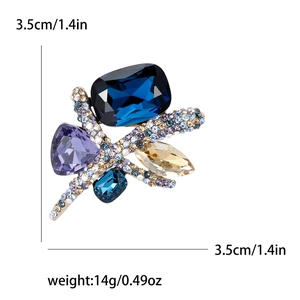 Broche papillon de luxe avec cristaux K9 colorés et strass brillants sur métal doré