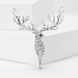 Detailed view of silver elk brooch with sparkling marquise rhinestones and clear crystals
