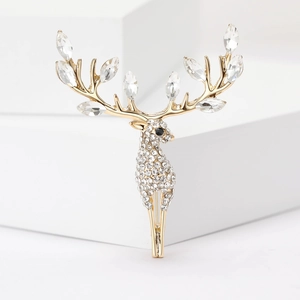 Elegant gold plated elk brooch featuring sparkling rhinestones and leaf shaped crystals