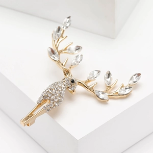Detailed macro view of an elegant reindeer brooch with marquise crystals and rhinestones