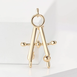 Polished gold alloy compass-shaped brooch pin for creative stationery fashion accessory