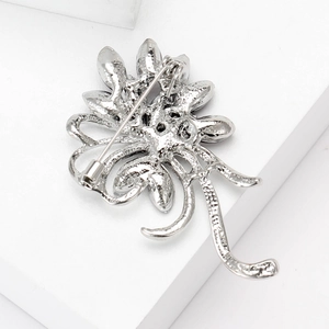 Elegant rhinestone bauhinia flower brooch back view with secure silver plated pin clasp