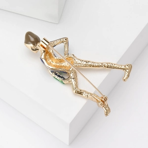 Elegant gold-tone female figure brooch with blue enamel and brown drop-shaped accent