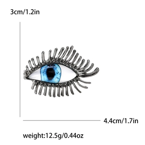Broche œil bleu vintage en métal argenté avec pupille réaliste et cils texturés