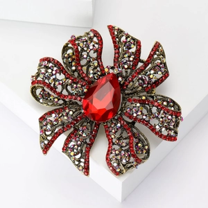 Vintage red crystal hollow flower brooch with baroque style bronze alloy and pear cut stone