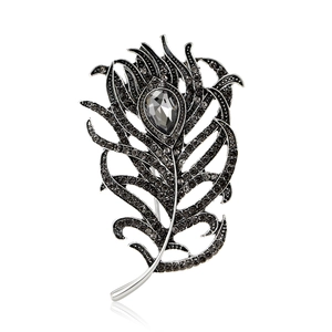 Elegant peacock feather brooch with smoky grey crystals and silver metal base design