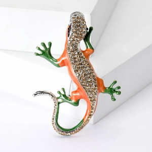 Vintage lizard brooch with colorful enamel and champagne rhinestones on white blocks