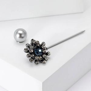 Vintage floral gunmetal brooch with deep blue crystal and silver pearl detail
