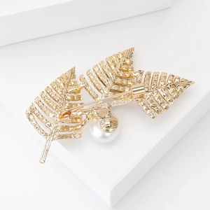 Back view of gold leaf pearl brooch with secure pin clasp on a white background