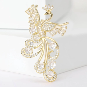 Luxury copper peacock brooch with shimmering white zircons on minimalist background