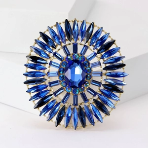 Luxurious crystal oval brooch with royal blue stones and a vintage gold setting
