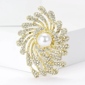 Elegant gold firework brooch with a large white pearl and shimmering rhinestones