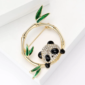 Fashionable panda brooch with golden bamboo ring and green leaves with white rhinestones