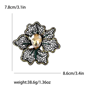 Hollow flower brooch in black metal with rhinestones and champagne gemstone, size guide