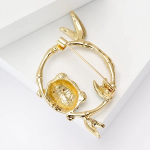 Fashionable panda brooch in a gold bamboo circle frame with luxury animal pin design