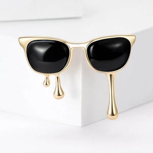 Chic cat-eye sunglasses brooch with golden fluid droplets and black enamel finish